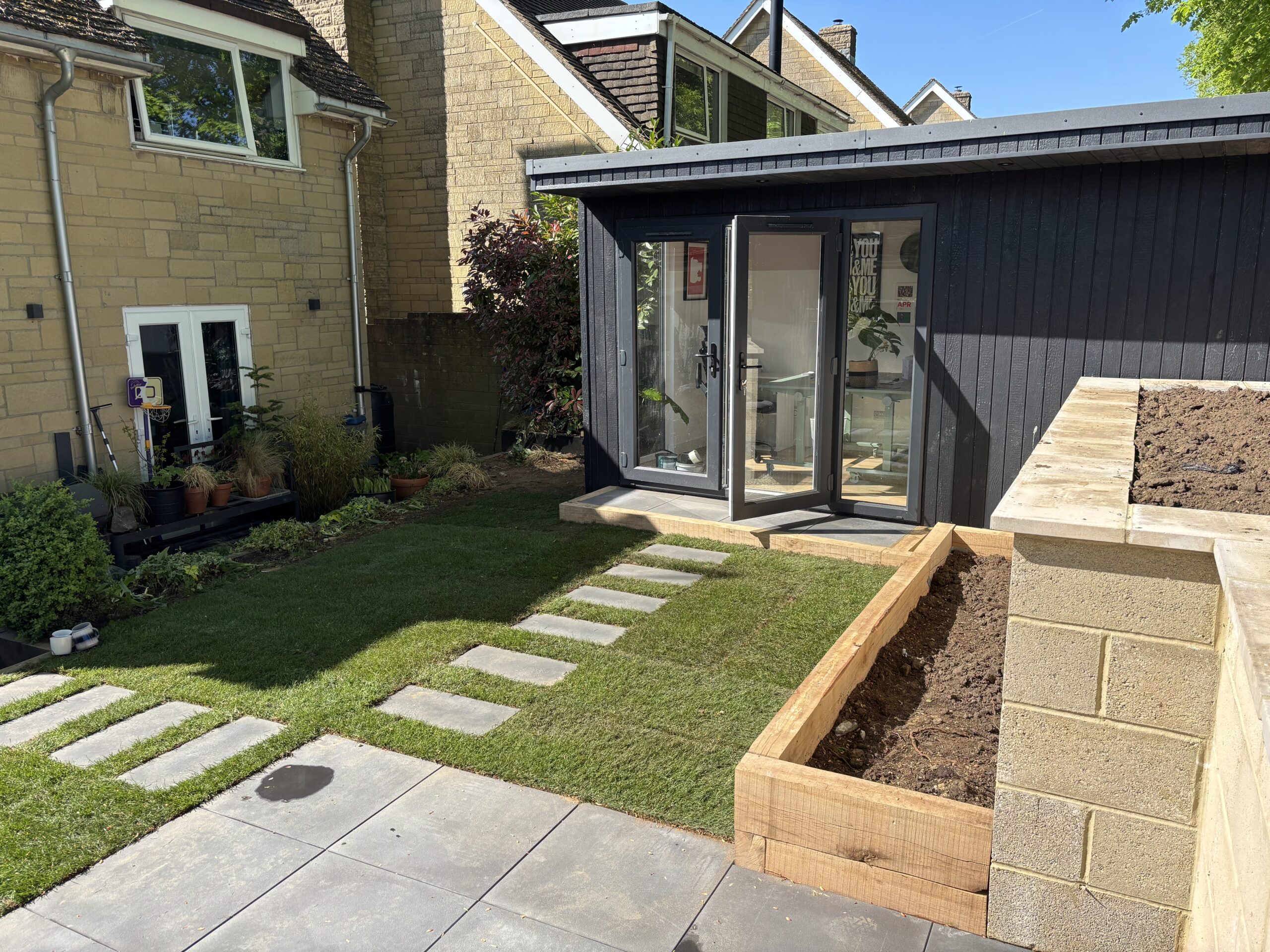 Recently finished Pent Haus garden room in garden next to house